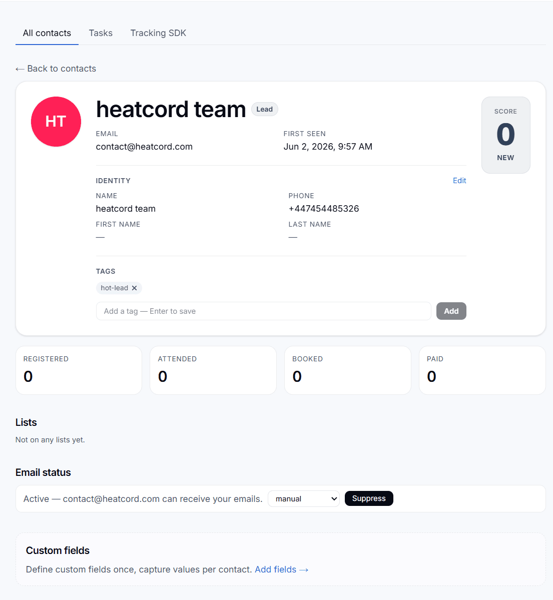 Heatcord contact profile showing a lead score, hot-lead tag, and registered, attended, booked, and paid status with email activity